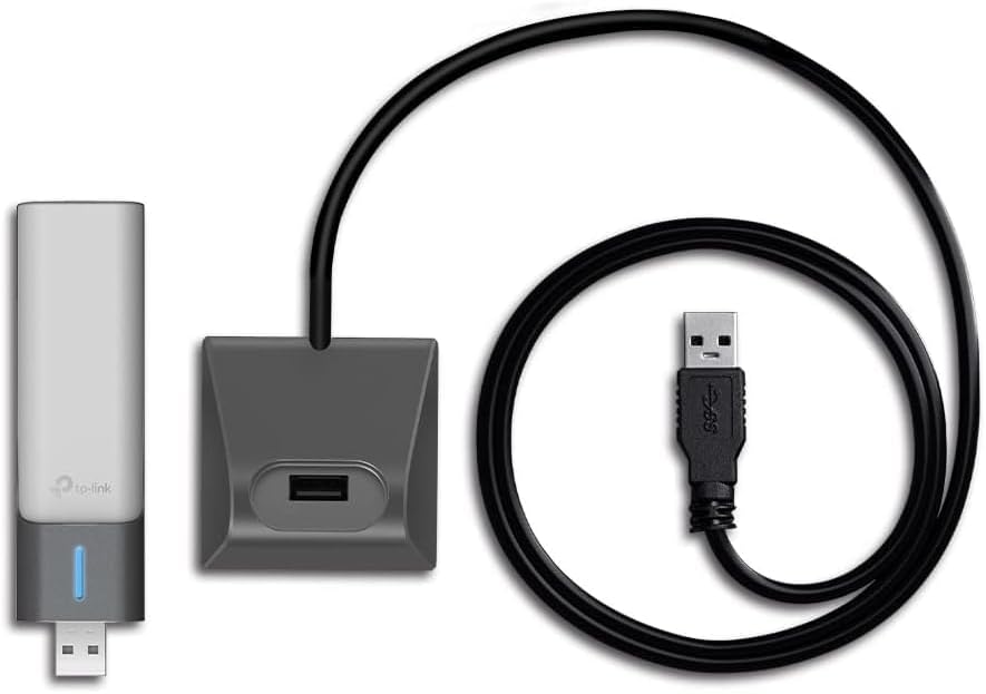 The three parts in the box: the WiFi 6 dongle, the desktop cradle with a USB-A port, and the detachable USB 3.0 cable