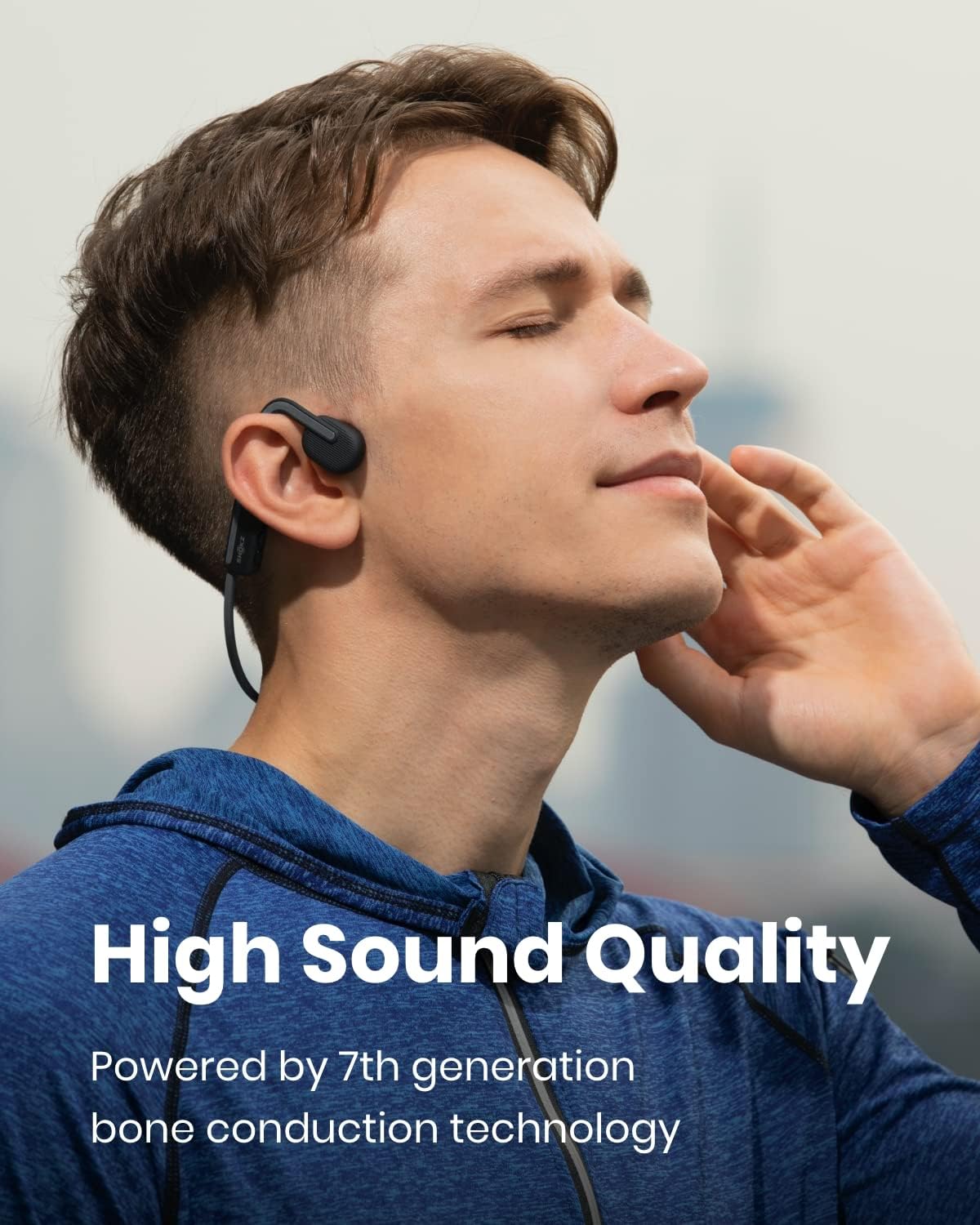 A man wearing the Shokz OpenMove, which uses 7th generation bone conduction technology